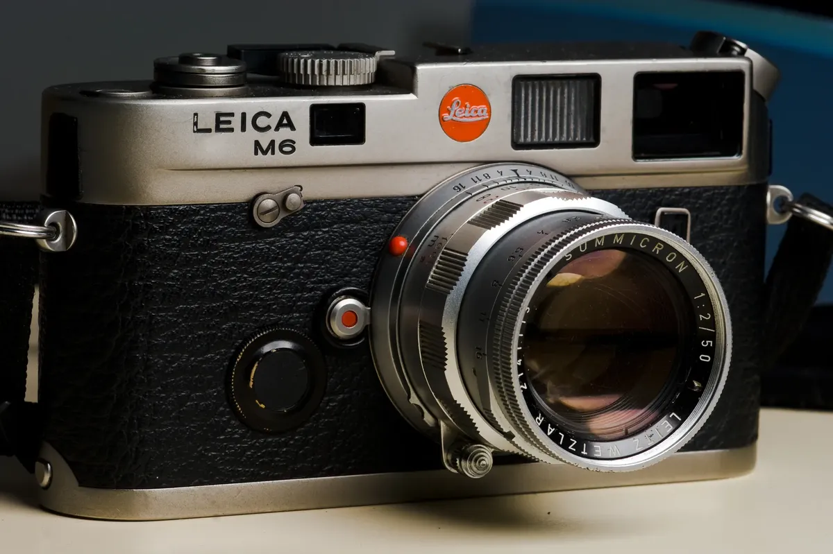 A detailed view of a vintage rangefinder camera showing intricate design and features.