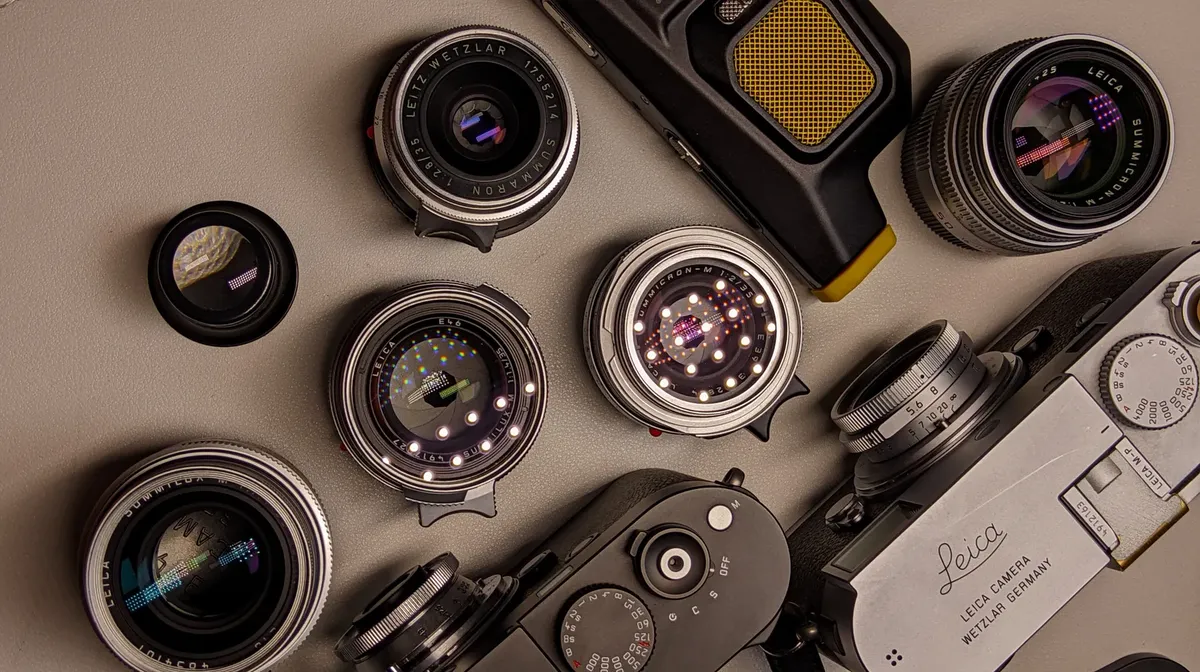 Top view of classic camera and lenses set with retro design elements.